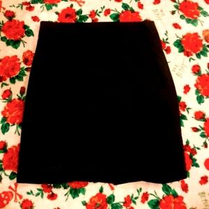 Black skirt with small slit up middle of back